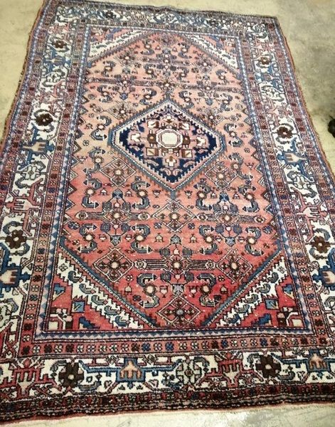 A Malaya red ground rug, 220 x 150cm